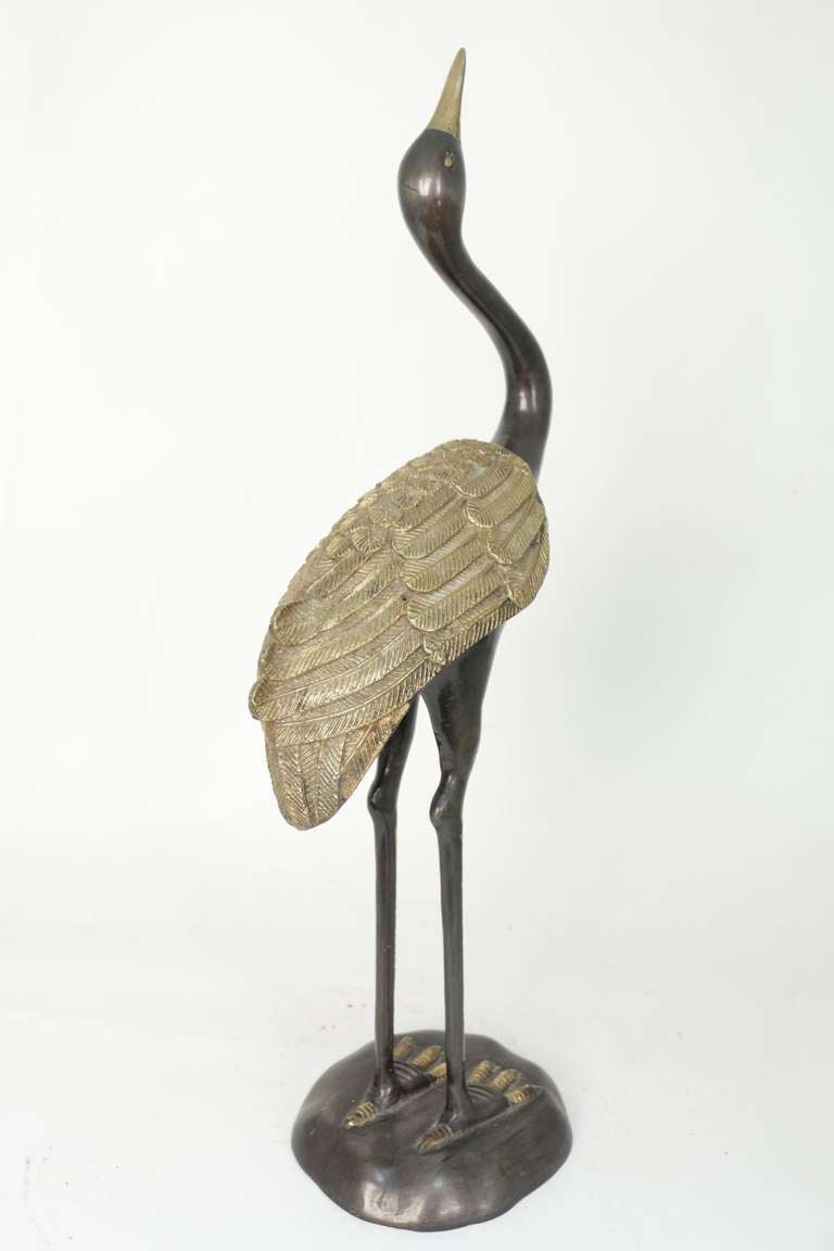 1970's bronze sculpture 'Le Heron' Maison Honoré.
Gilded bronze for the beak, the legs and the feathers. 'Canon de fusil' bronze for the rest.