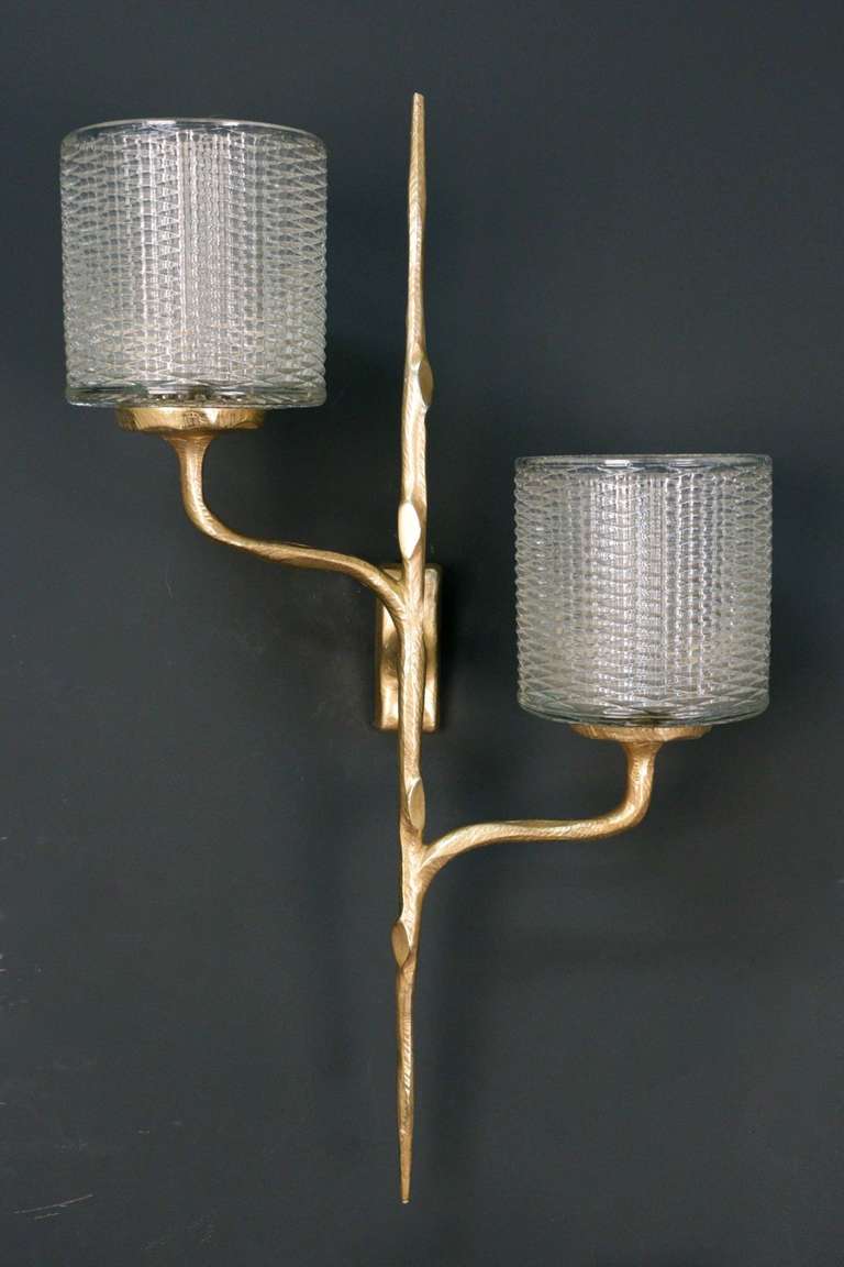 Pair of 1950's Asymmetrical Naturalist Sconces. One simple sconce with a gilded bronze fixture summoned by a molded cristal cylinder and a similar double sconce with two cristal cylinders. Cristal is in perfect condition.