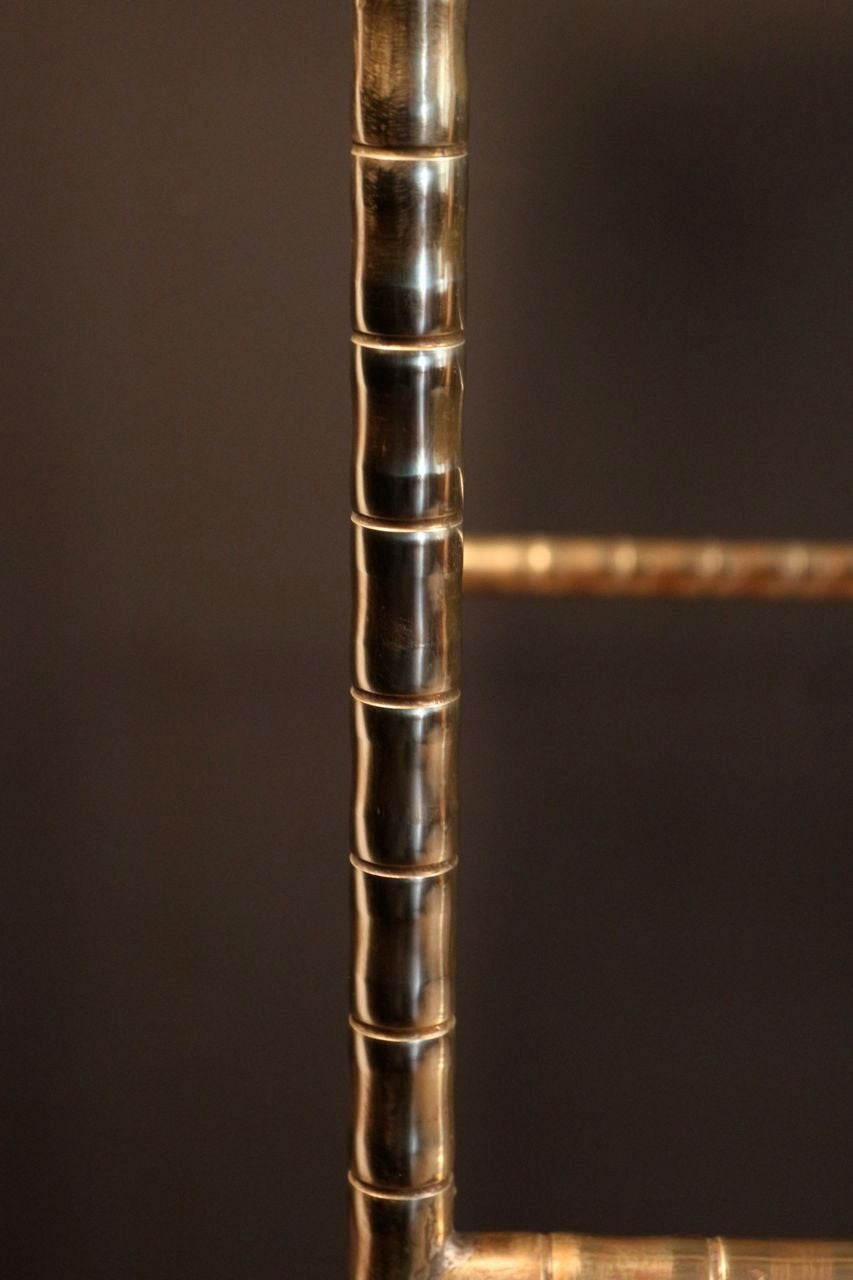 Large console table by Maison Bagues custom made for a Parisian fashion house.
Brass, adjustable feet height, the top is covered with a glass pane.
A second brass table console from the same fashion house is listed on the site under reference