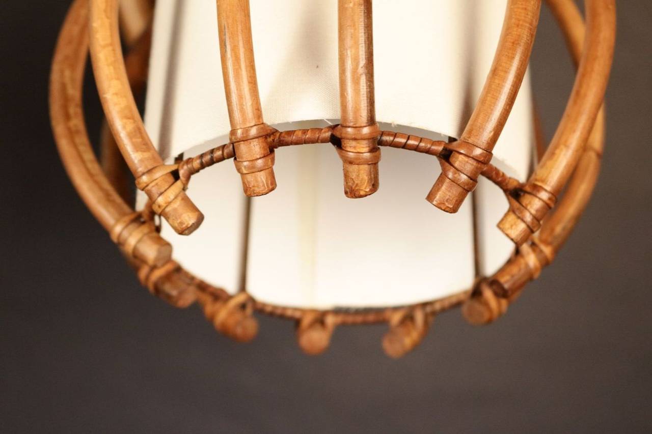 French Pair of 1950s Rattan Sconces Attributed to Louis Sognot