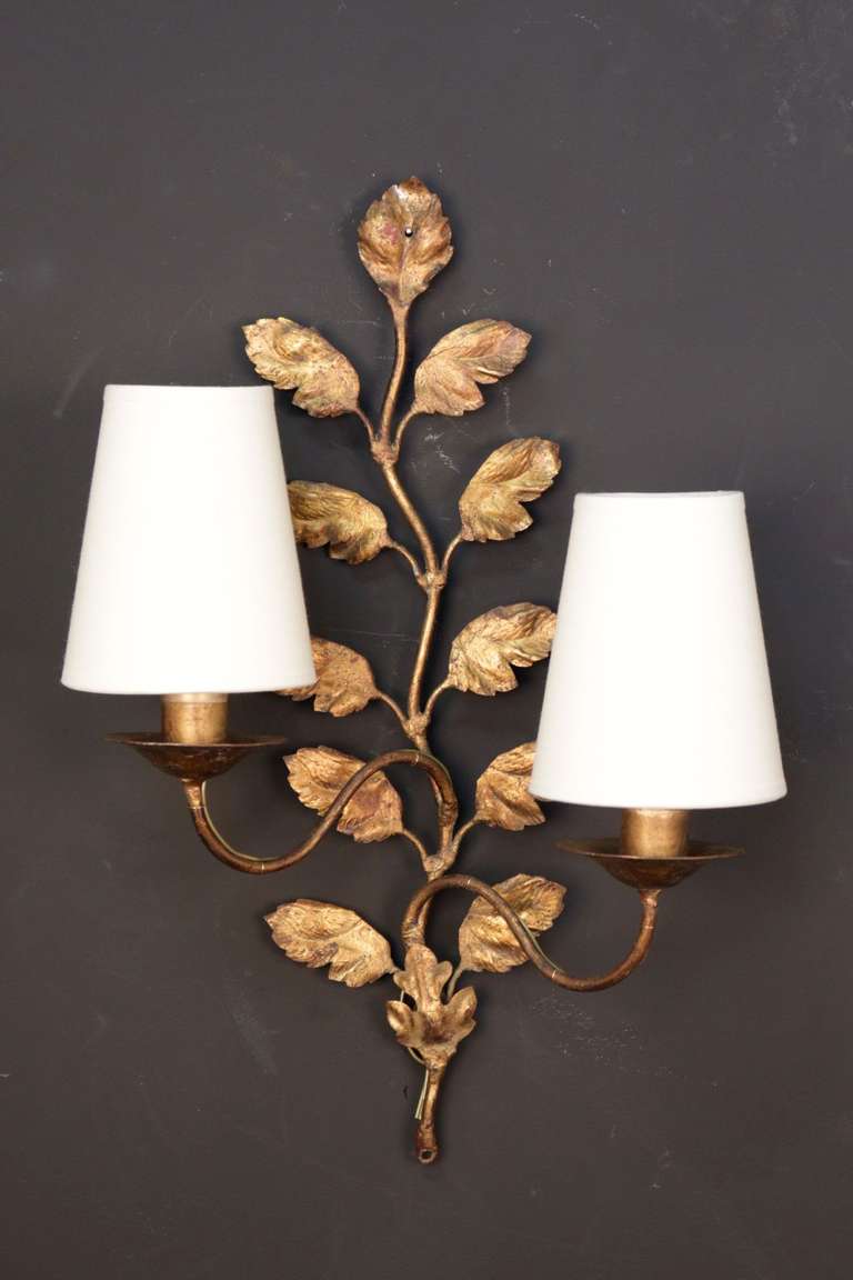 Pair of 1960's Leaves sconces with two lighted arms per sconce. 
New shade.