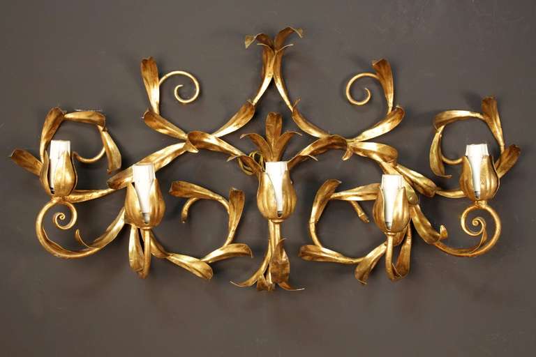 Pair of large 1965 sconces with a gilt wrought iron foliage decor.

Five wired lighted arms per sconce.