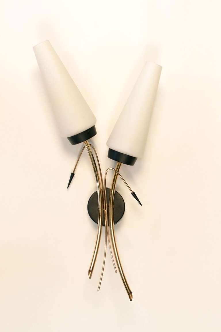 Pair of 1950's Sconces by Maison Lunel. Two lighted arms per sconce. Opalin shade. Brass axe and brass and blackened arrow.