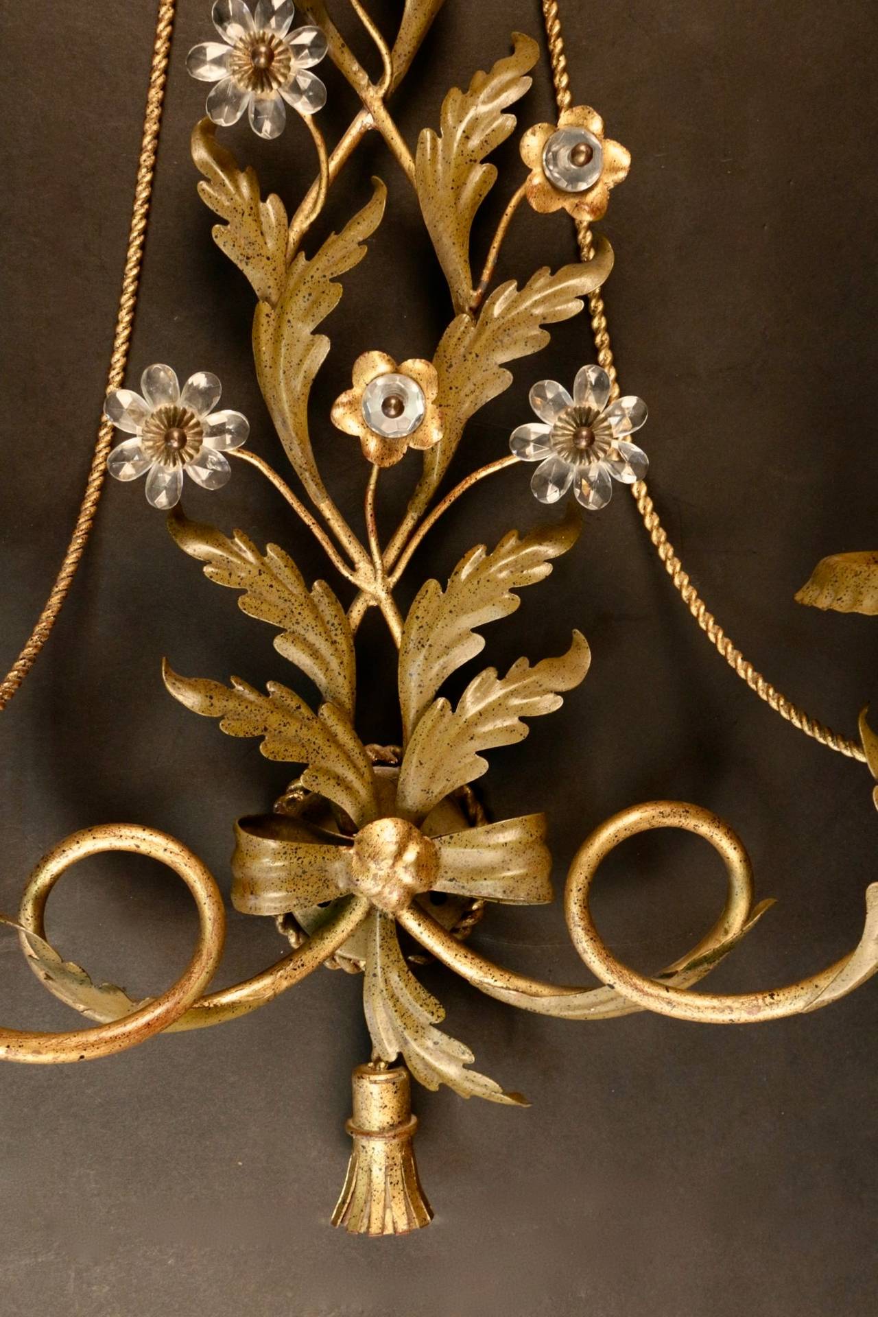 Large pair of 1970s sconces by Maison Roche in the style of Maison Bagues. 

Nice trimming decor in matte gilded metal foliage. Glass flowers declined in two ways: either glass petals and gilt metal pistils or gilt metal petals and glass