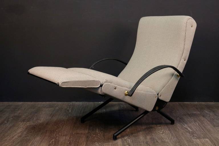 1954s Osvaldo Borsani relaxing system armchair.
Cover redone according to the original spirit.
Jab fabric tranquility model.
Tubular iron frame. 
Two brass handles to adjust the backrest and seat. 
The footrest folds under the seat. 
Armrests