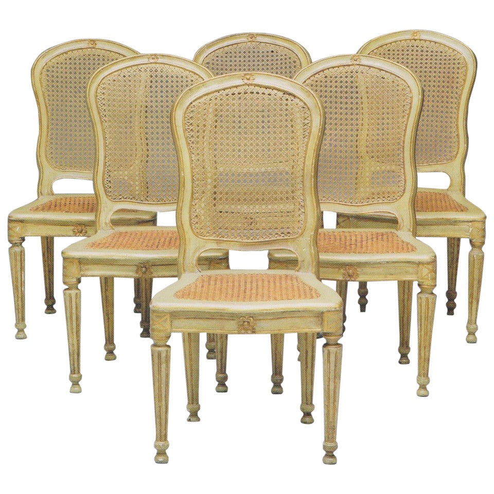 Ensemble de six chaises italiennes du 18ème siècle peintes et dorées à la feuille