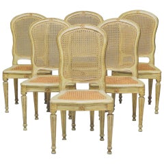 Ensemble de six chaises italiennes du 18ème siècle peintes et dorées à la feuille