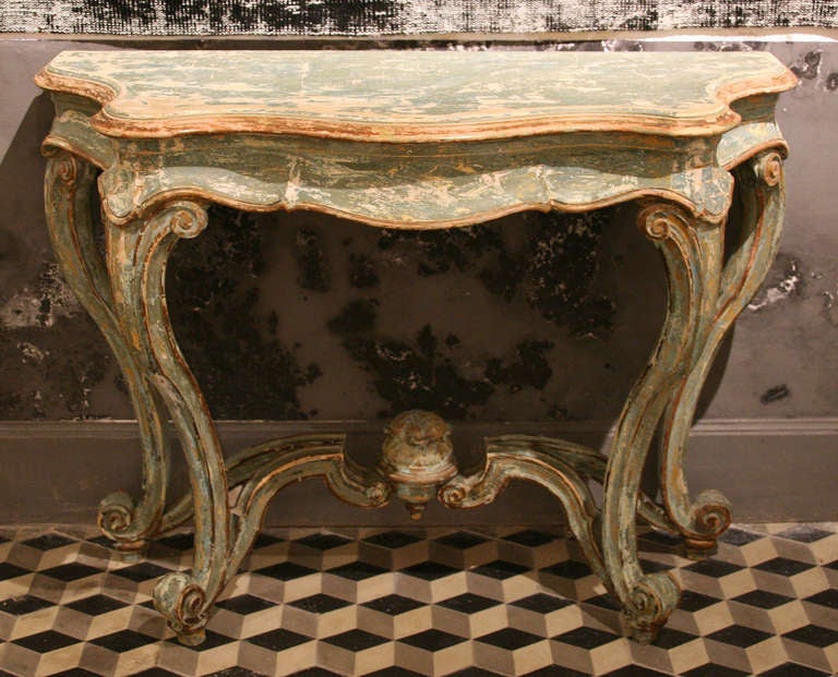 Superb Italian console from the XIXe century. Carved and patinated wood. A remarkable piece of work!