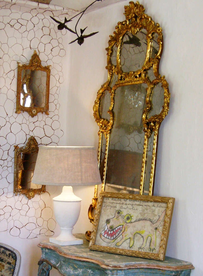 Beautiful parcloses mirror, with fine frame in golden and copper patinated wood. Fine vegetal carved patterns. Misted up mirror. Vintage ring at the back to hold it. Haughtiness!