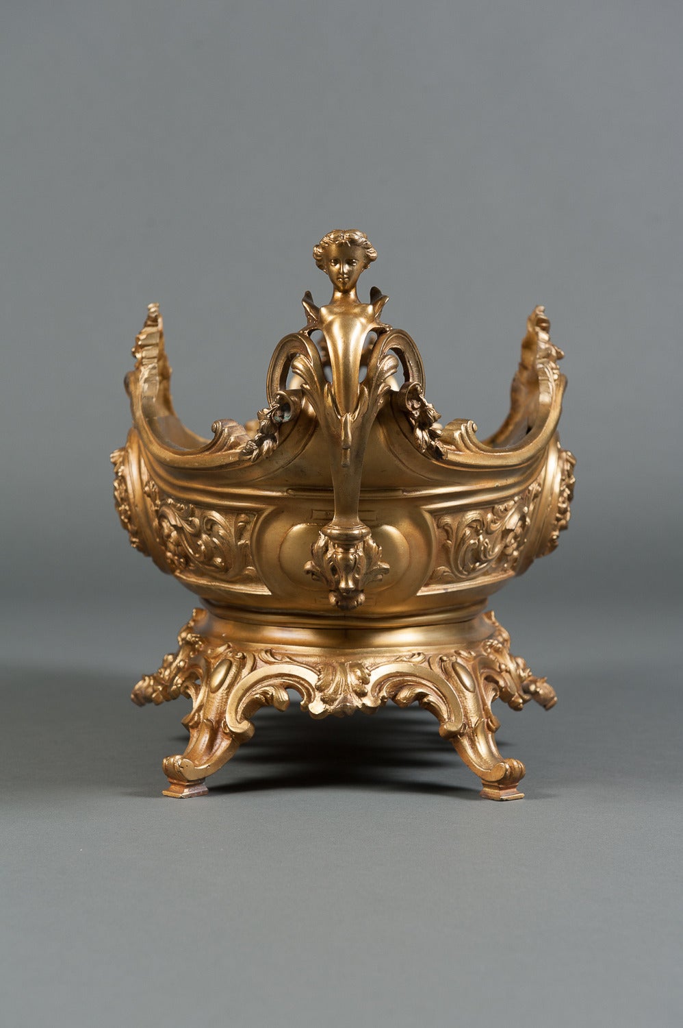 A large antique French gilt bronze figural centerpiece flanked by female herm-form handles.
Circa 1900

Height: 13