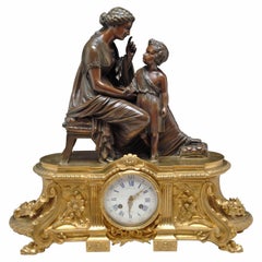 Pendule de cheminée figurative française du 19ème siècle en bronze doré et patiné par Raingo