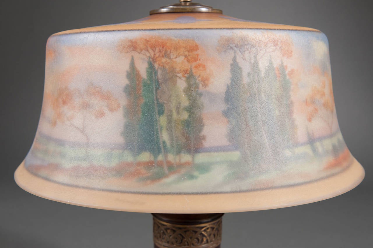 American A Reverse Painted Pairpoint Landscape Lamp with Carved Wooden Base For Sale