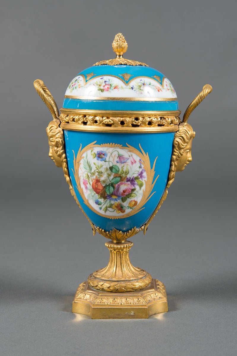 A Pair of 19th Century French Gilt Bronze Mounted Turquoise Ground Painted Vases with Lids

Circa 1880

Origin: France

Height: 11