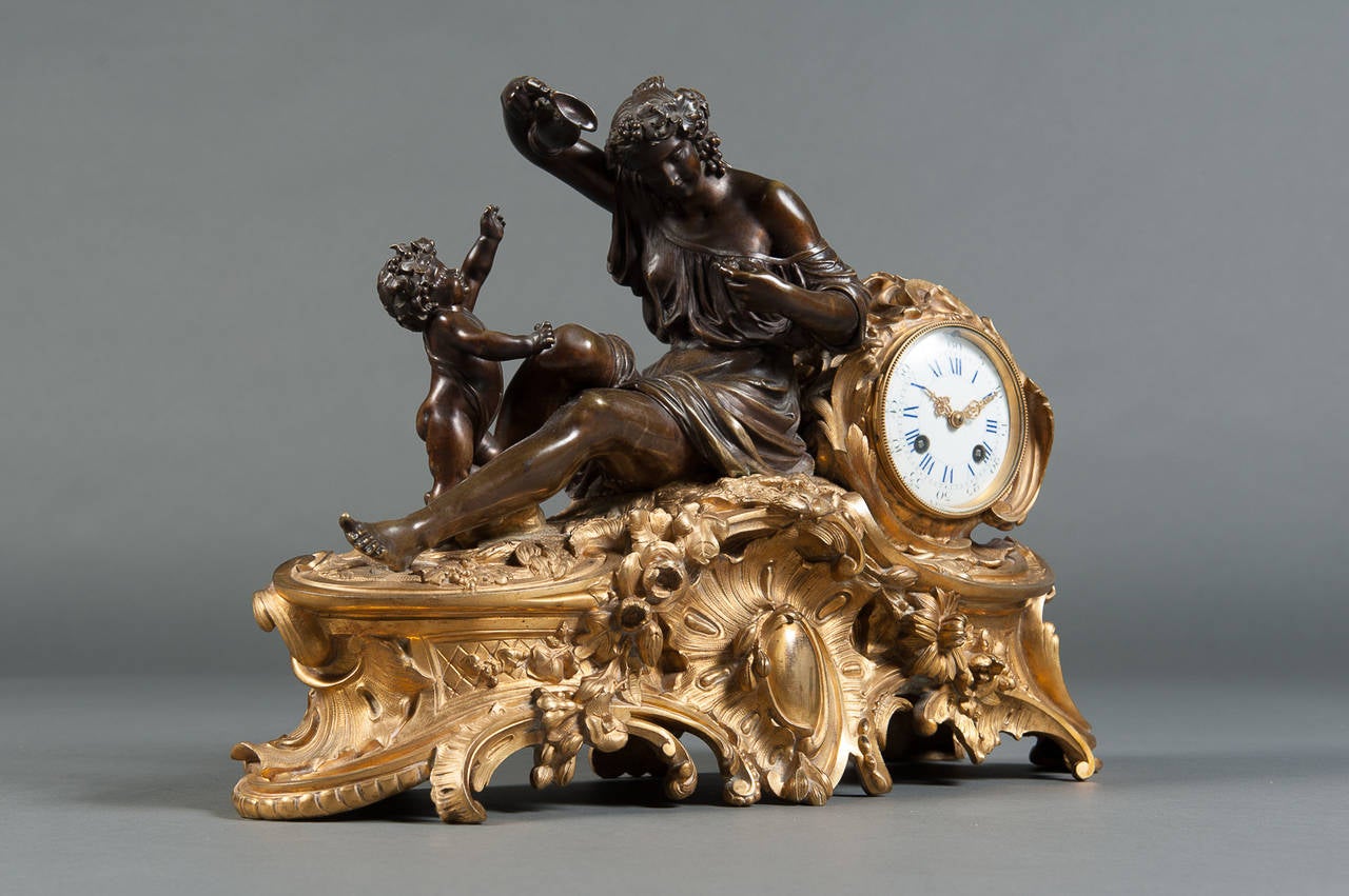 A Late 19th Century French Gilt and Patinated Bronze Figural Mantle Clock 1