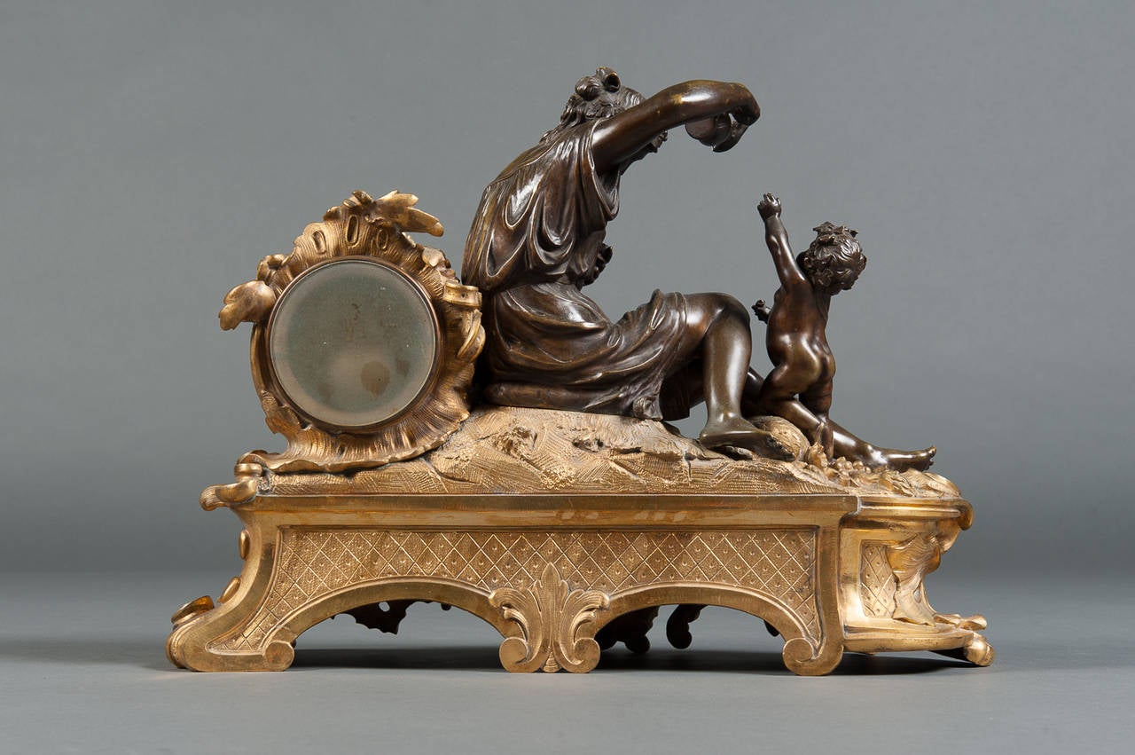 A Late 19th Century French Gilt and Patinated Bronze Figural Mantle Clock

Circa 1870

Origin: Paris

Height: 13