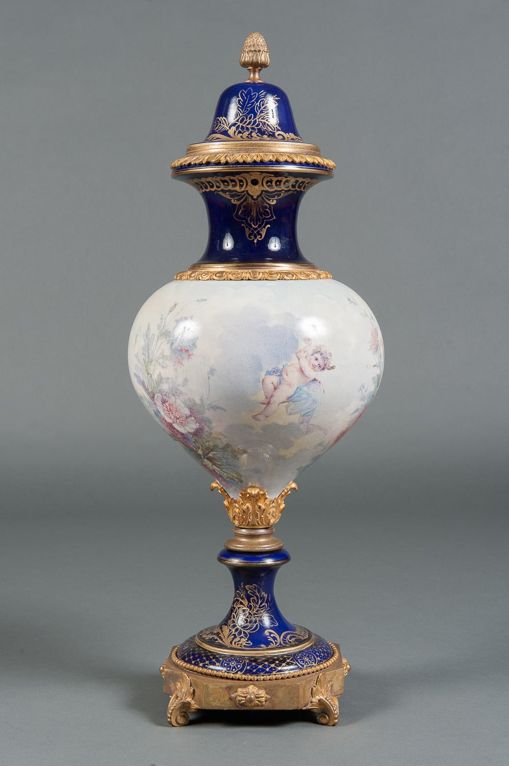 An Unique French Sevres Style Hand Painted Porcelain Lidded Vase

Circa 1890

Origin: France
 
Height: 30″  
Width: 11″
Depth: 11