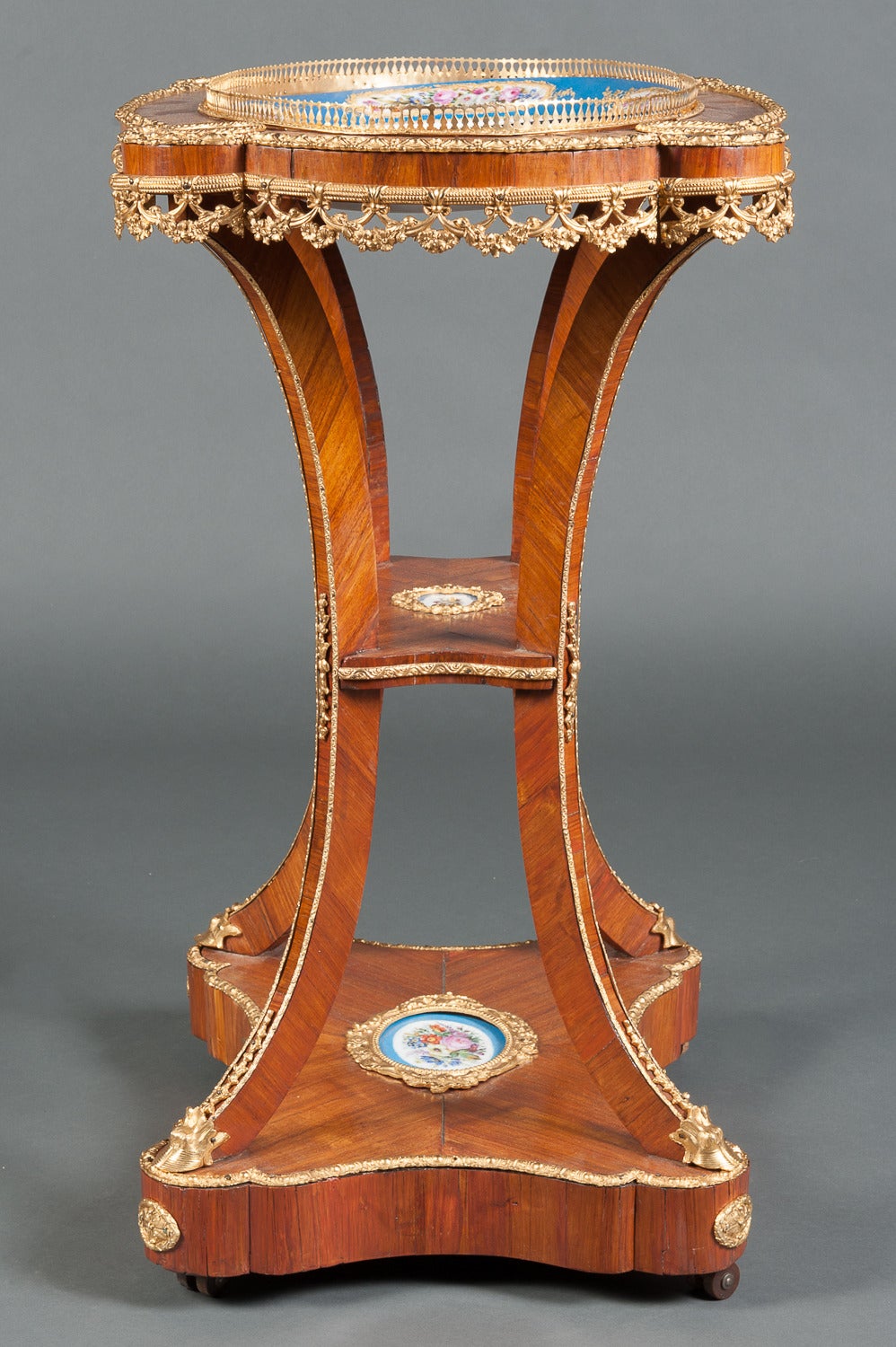 A 19th Century French Sevres Style Hand Painted Bronze Mounted porcelain side Table.

Circa 1870
 
Origin: France

Height: 32″
Width: 24″
Depth: 19″

Style: Louis XV

Material: Bronze, porcelain

Maker: Sevres Style 

Excellent Condition

Decorated
