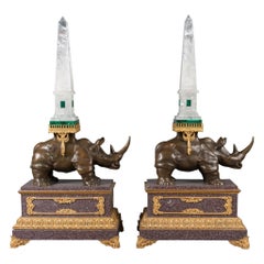 A Pair of Louis XVI Style Bronze Rhinoceros Figures with Rock Crystal Obelisks