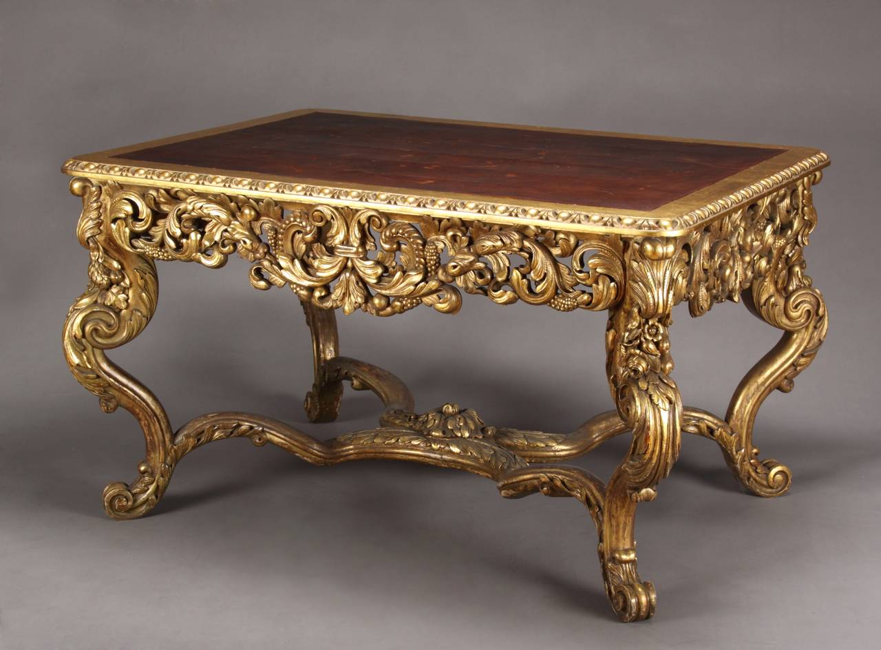 A Large Italian Carved Gilt Wood Rococo Style Rectangular Center Table With a Leather Top

Italy, Circa 1870

Highly carved in the Rococo style raised by four legs connected by a stretcher

Dimensions: Height: 32″ (81 cm) Width: 55″ (139 cm)