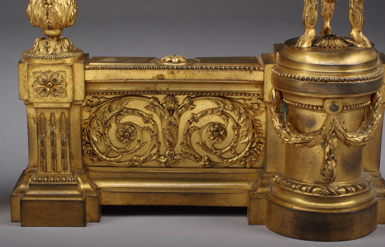 Circa 1880
 
Origin: France
 
Height: 16″
Width: 15″
Depth: 5″
 
Style: Louis XVI
 
Gilt bronze ram head motif chenets decorated with gilt bronze scroll and swags design.