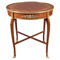 Gilt Bronze-Mounted Mahogany, Kingwood, and Satinwood Marquetry Center Table