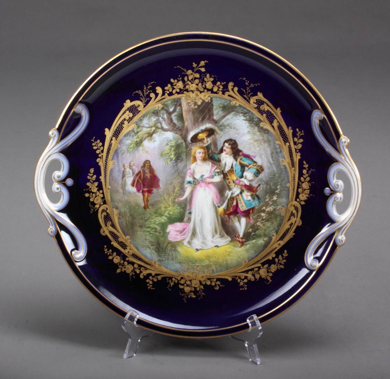 circa 1870.
 
Origin: France.
 
Maker: Sevres.
 
Material: Porcelain.
 
Dimensions:
 
Tray: Diameter 14.25″.
Sugar Bowl: 5″.
Creamer: 4″.
Teapot: 6 3/4.
 
Comprising of a double handle tray, covered teapot, cream jug and a covered