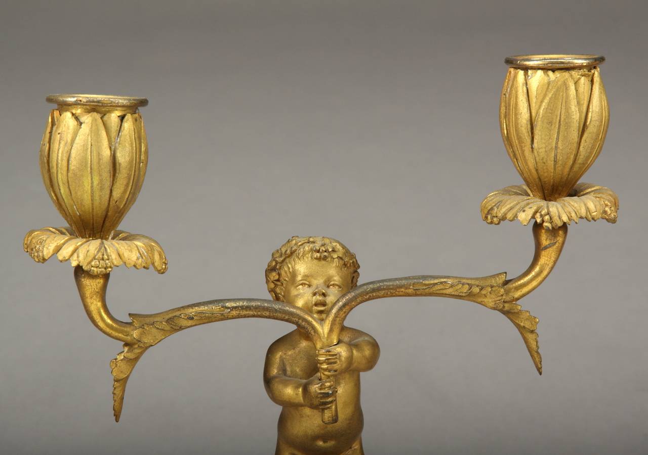 A Pair of French Antique Bronze & White Marble Figurative Candle Holders In Good Condition For Sale In Los Angeles, CA