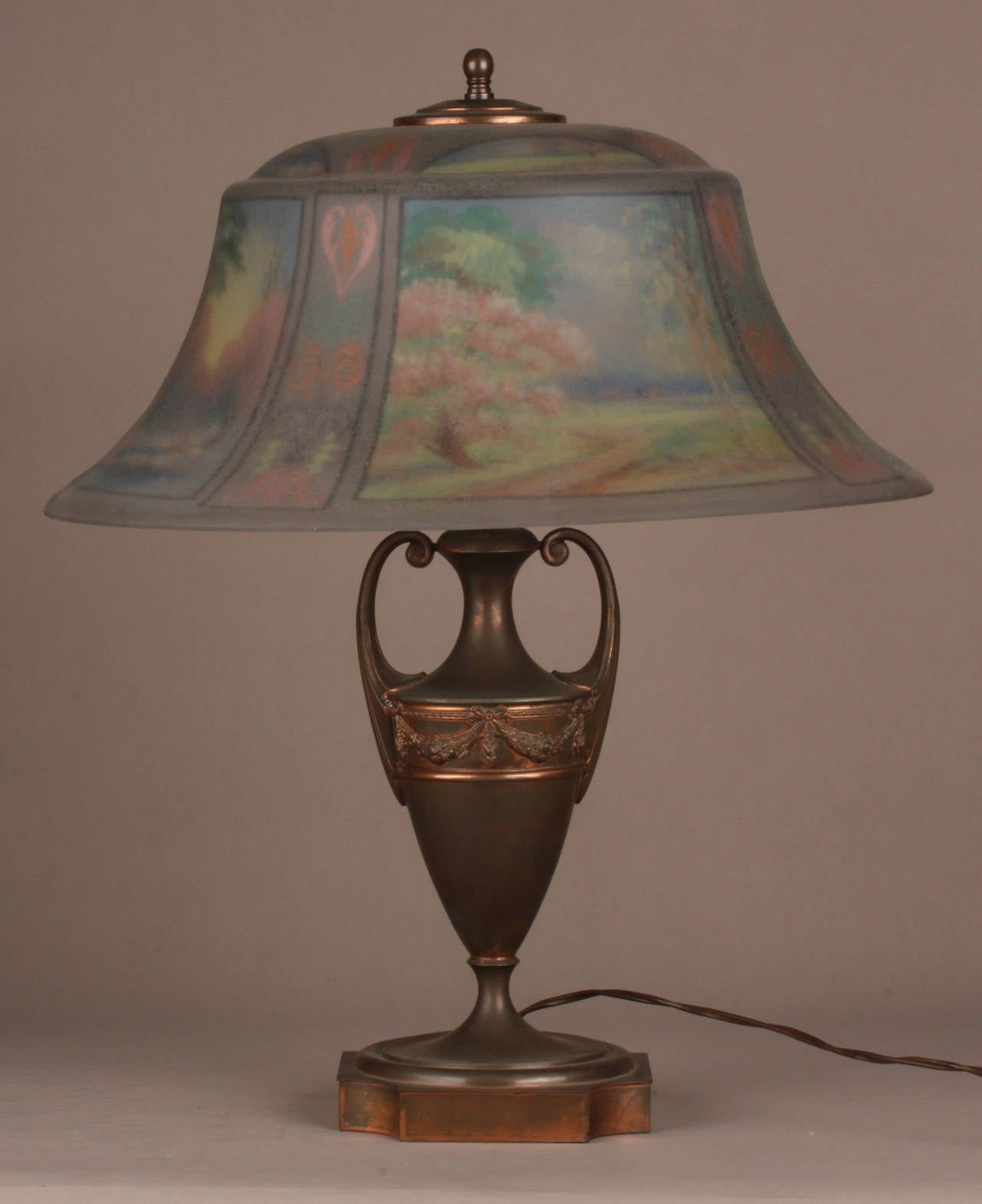 A Pairpoint Reverse Painted Art Nouveau Lamp Depicting the Four Seasons

Circa 1910

Origin: Massachusetts, United States

Diameter: 17.25