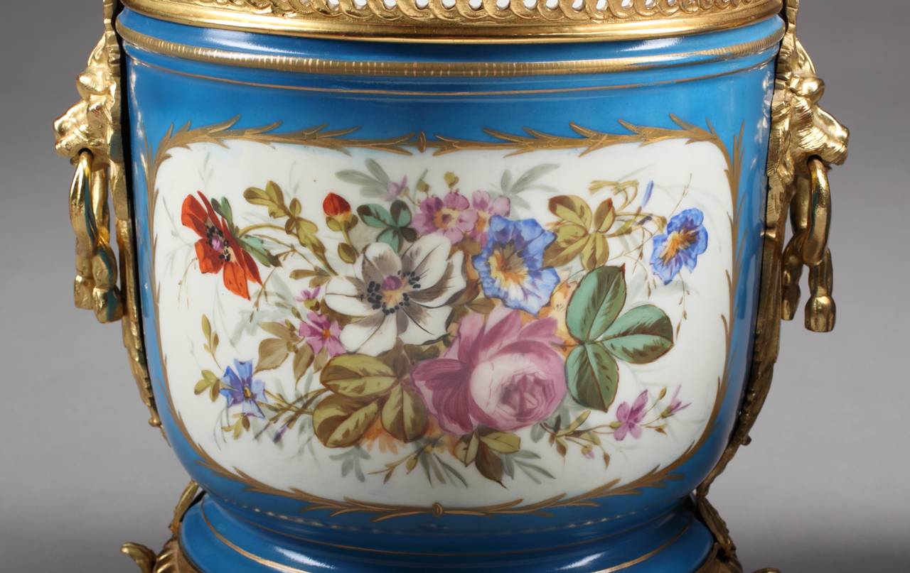 Period: 19th Century
 
Origin: France
 
Height: 11″ (27cm)
Diameter: 9.5″ (24cm)
 
Maker: Sevres Style

One vase is professionally restored