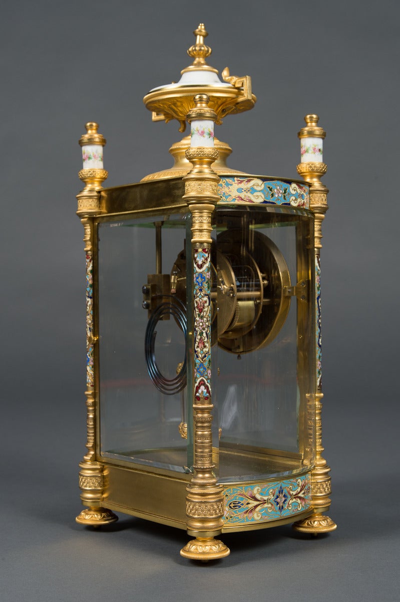 A fine 19th century antique French champlevé enameled, ormolu bronze and painted porcelain clock set,

circa 1880.

Origin: France.

Clock:
Height: 17 3/8