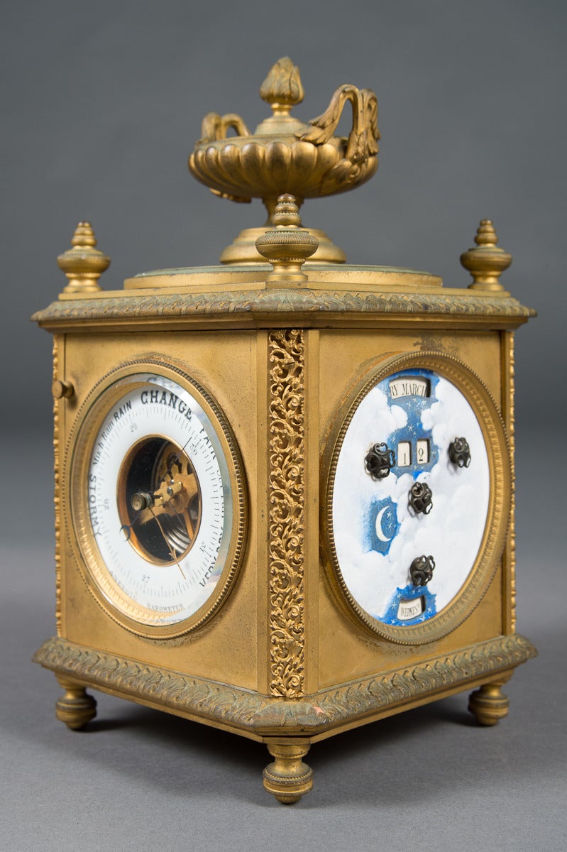 A French gilt bronze eight-day four face mantel clock with date, temperature and barometer,

circa 1855.

Origin: France.

Dimensions: Height: 9.5