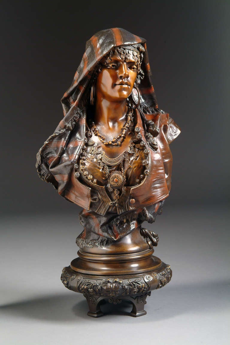 A 19th French Orientalist polychrome-patinated bronze bust entitled Femme de Mequinez.raised on original Orientalist base 
Signed: H. Plee Sculpteur.

Henri Honore Plé (1853-1922) was a student of Gérault and Mathurin Moreau, he also worked as a