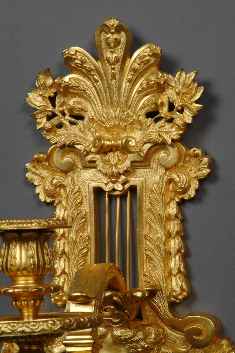 A Pair of French Antique Gilt Bronze Three-Light Wall Sconces With Figural Heads In Excellent Condition In Los Angeles, CA