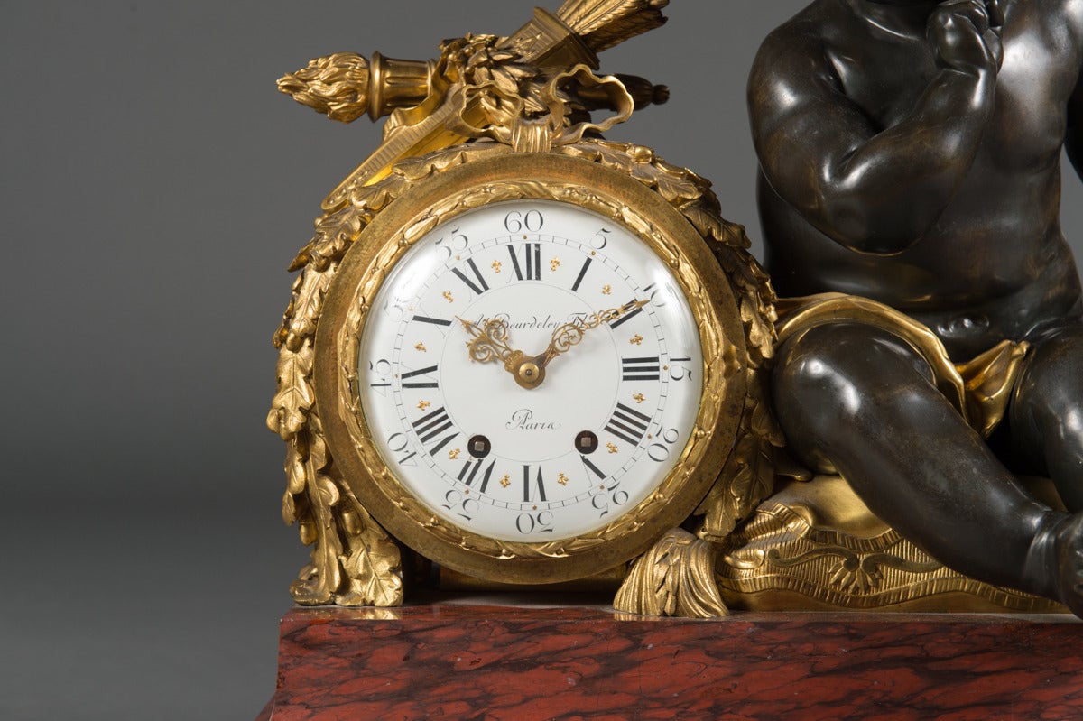 A French Napoleon III Period Rouge Marble Gilt & Patinated Bronze Mantel  Clock Alfred Emmanuel Louis Beurdeley

Movement marked: J. Lefebvre Fils Paris & Numbered1938
Movement stamped: Medaille De Bronze J. Marti & Cie & Numbered 92
Dial