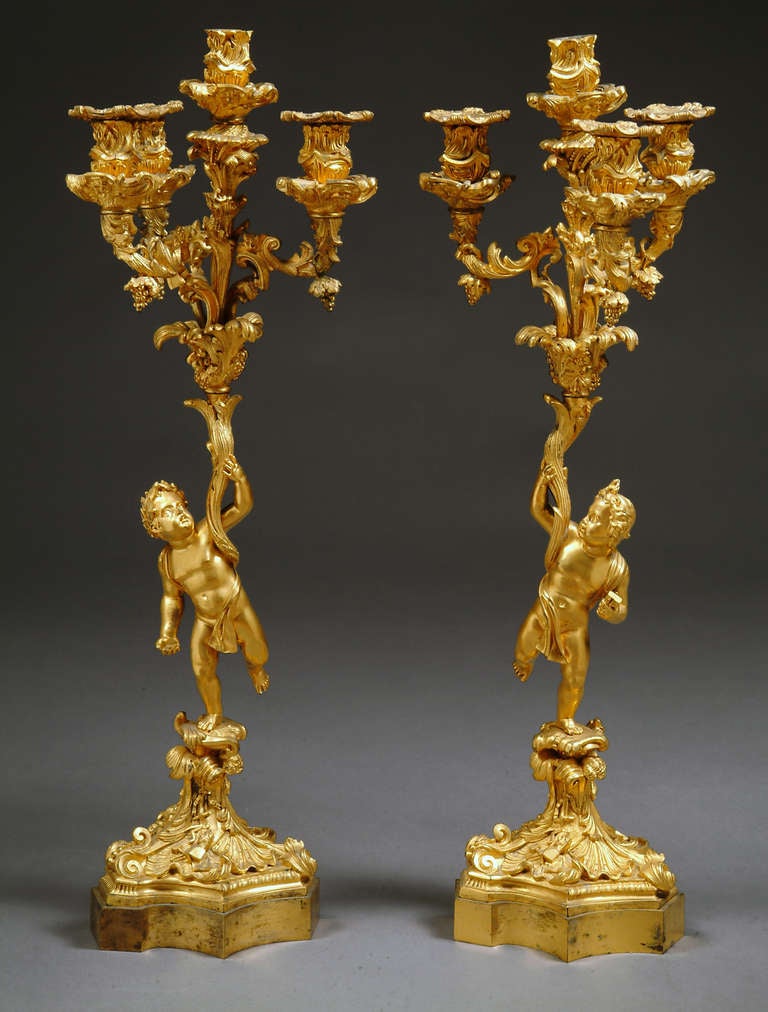 A pair of very fine 19th Century French gilt-bronze 4 light figural candelabras.