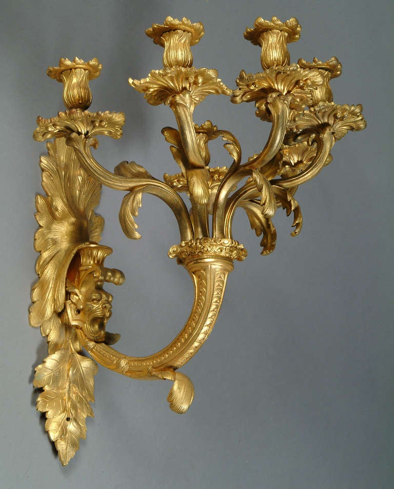 A Pair of French Louis XV style Gilt-Bronze 5-light Wall Sconces with Lion Heads In Excellent Condition In Los Angeles, CA