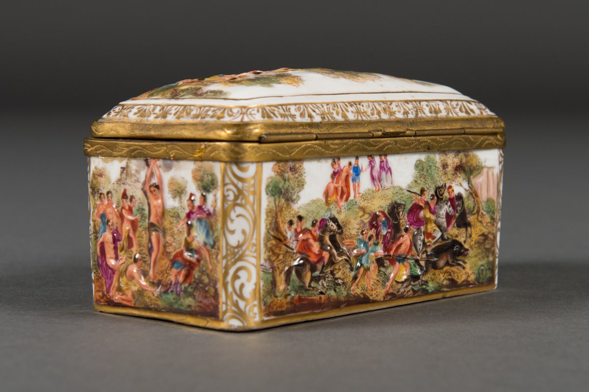 An Early 20th Century Italian Capo Di Monte Brass Mounted Box

Depicting Jesus & a battle scene, with horses and winged cherubs with arrows. Outlined in gold with gilt brass mounts

Italy, Circa 1920 

Signed: N with Crown & Numbered 763