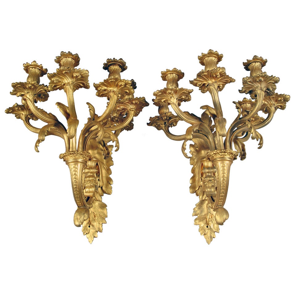 A Pair of French Louis XV style Gilt-Bronze 5-light Wall Sconces with Lion Heads
