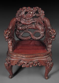 A Japanese Export Carved Rosewood Armchair with Dragon Handles