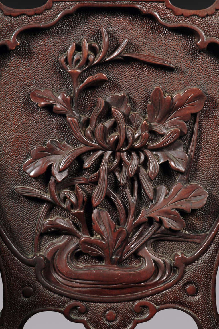 Fine early 20th century Chinese hand carved hardwood armchair 
elaborately decorated with flowers and foliage.
Signed.