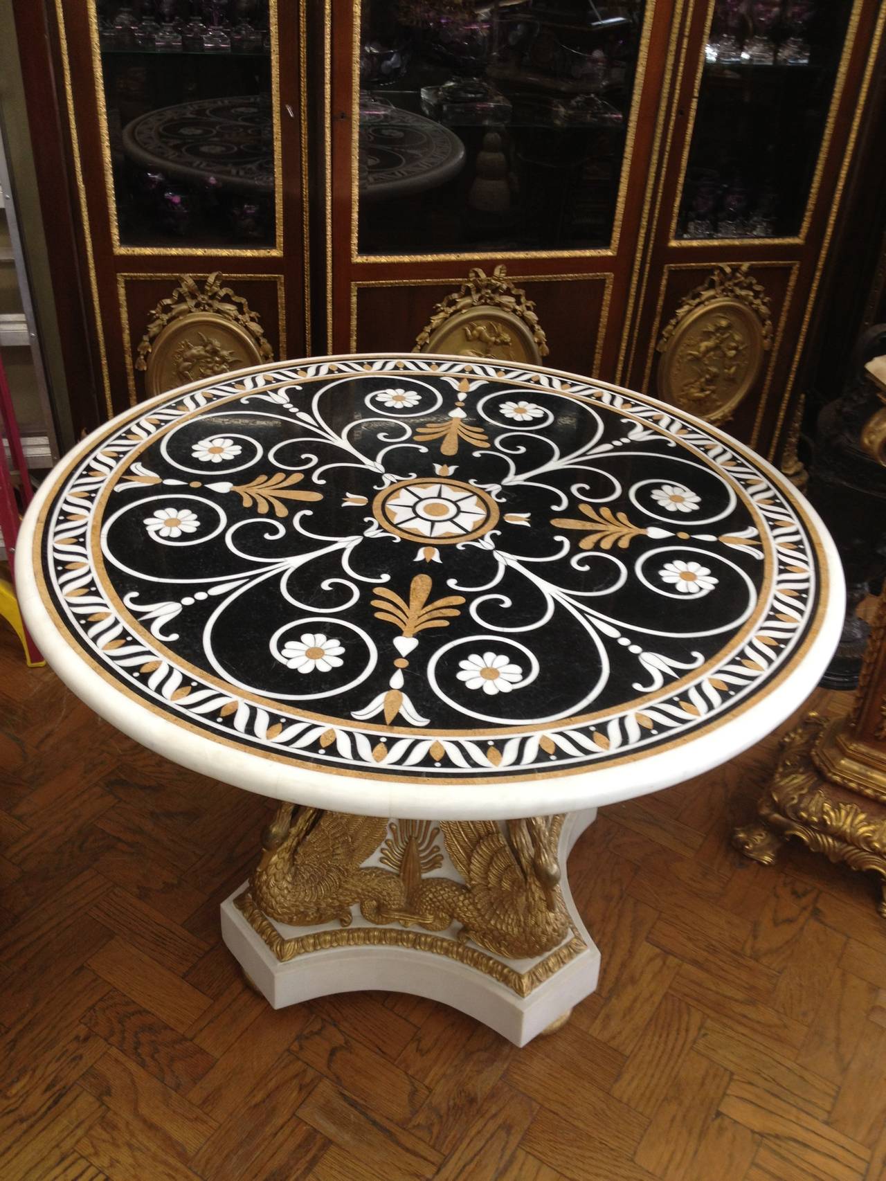 A 20th Century Italian Style Marble Inlaid & Gilt Wood Mounted Center Table

Dimensions: Height: 32", Diameter: 45"

Excellent Condition


