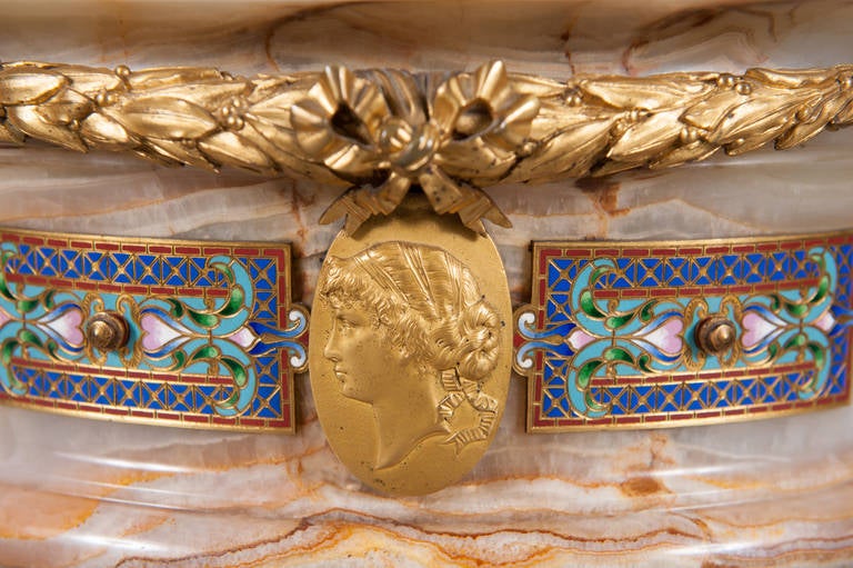 A very fine and important French 19th century onyx-gilt bronze, patinated bronze and Champleve enamel Jardinie're by Euge'ne Cornu

Surmounted with a pair of patinated bronze cherubs. 
By Euge`ne Cornu and Attributed Design to G. Viot & Cie.