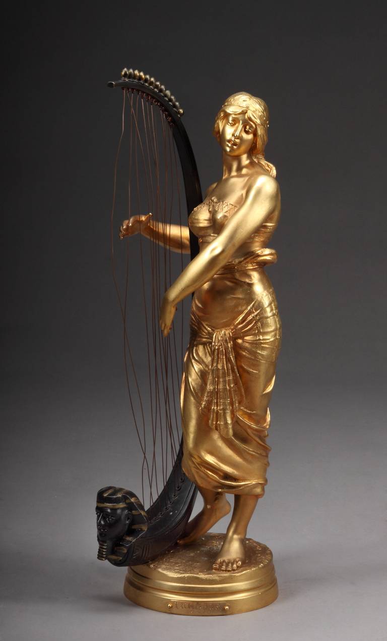 Georges Charles Coudray (Paris, 1883-1932)
A Fine 19th century French Gilt and mid-brown Patina figure of an Orientalist Woman Playing Harp with Sphinx Head.
Signed: Coudray AP
with seal of Societe des Bronze de Paris
Plaque reads: Tahoser, Prix