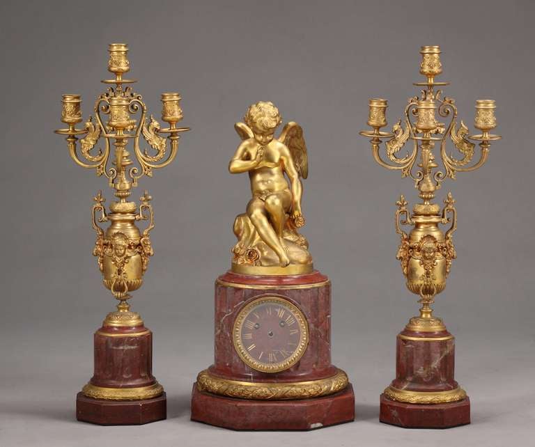 Fine 19th century French gilt bronze mounted Rouge marble 3-piece figural clock set

Clock:
Height: 19.5