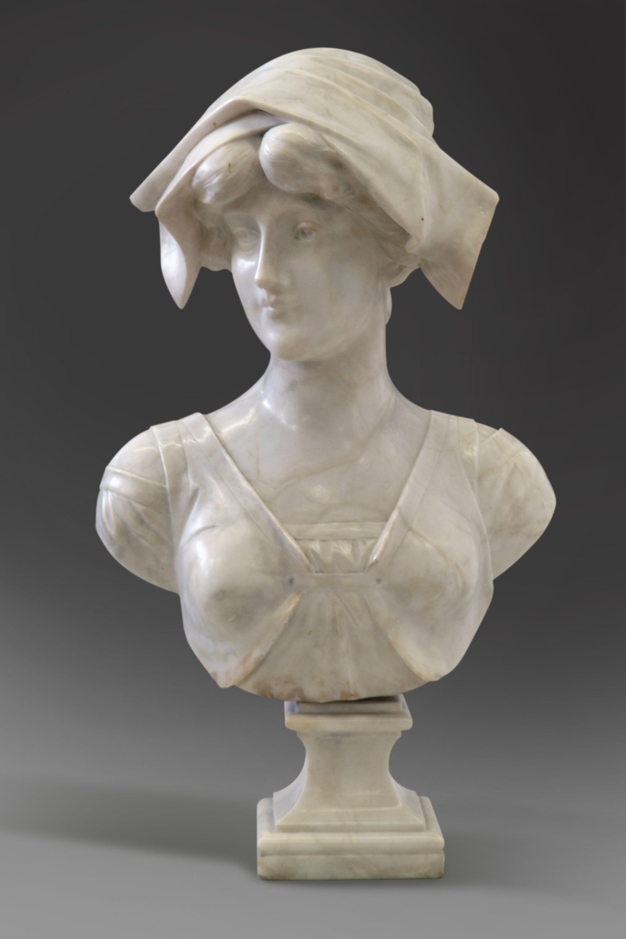 A 19th Century Italian Carrera Marble Bust of Girl Wearing a Hat