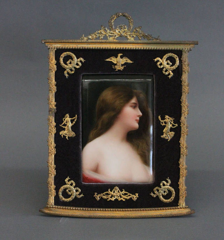 A Berlin Hand Painted Porcelain Plaque Depicting Erbluht (Blossoming Girl).

In a 19th century German gilt bronze mounted frame.

Germany, Circa 1900

Impressed with Germany and

Signed: Wagner on bottom left of