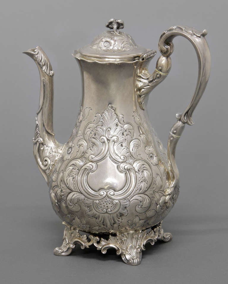 Mid- 19th century American tea service by William Forbes for Ball, Tompkins and Black, New York. pear-form bodies with overall floral and foliate decoration.