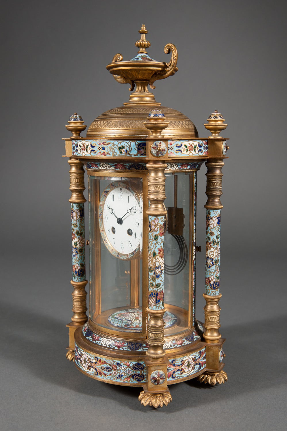 A Large French Champleve Enamel & Gilt Bronze Four Glass Regulator Clock by Hour Lavigne

Paris, Circa 1880. 

The case topped by urn pediment and brass finials, with beveled glass to all sides. 

Case Marked: JUST, Made in France 1411.48 C.H