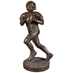 Contemporary Bronze Sculpture of a Young Football Player.