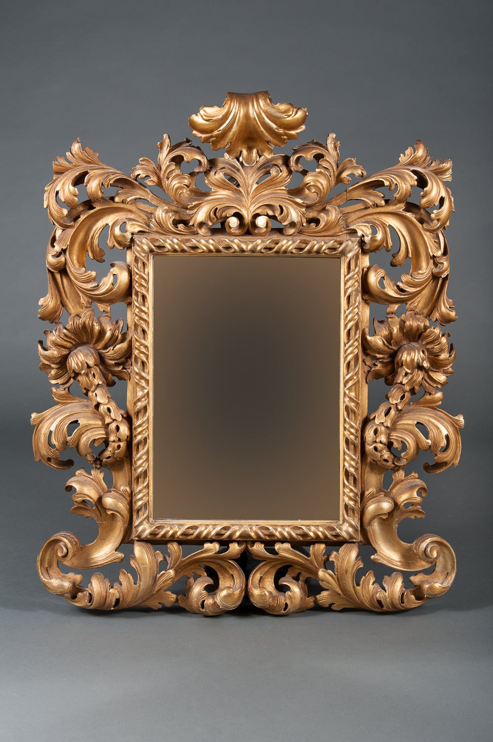 An Intricate 19th Century French Giltwood Rococo Style Vanity or Wall Mirror

Circa 1880
 
Origin: French 

Depth: 4